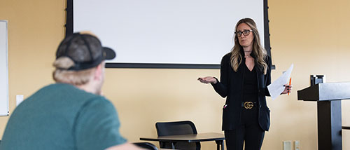 criminal justice program professor standing in front of a class teaching students in the criminal justice program in Missouri