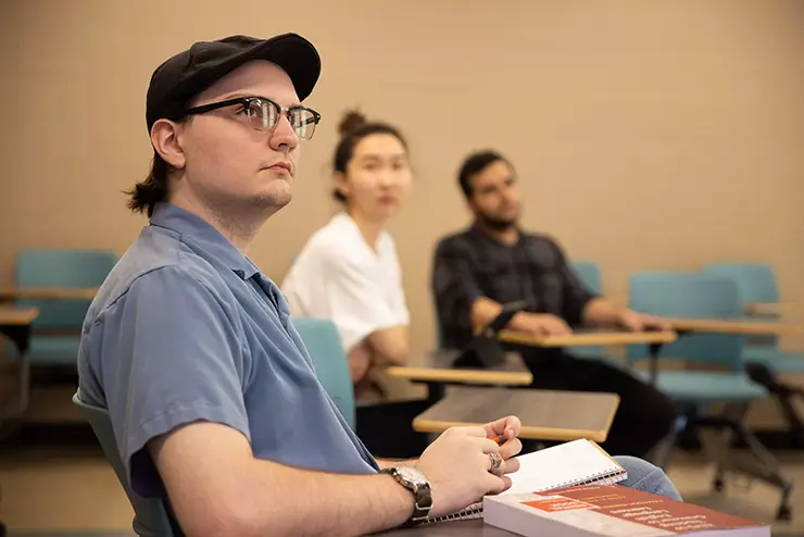 a communiation student looks up, listening to the instructor during class at semo a Missouri college known for job readiness