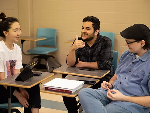 three english students sit together in a group to discuss a class project at semo a Missouri college known for job readiness