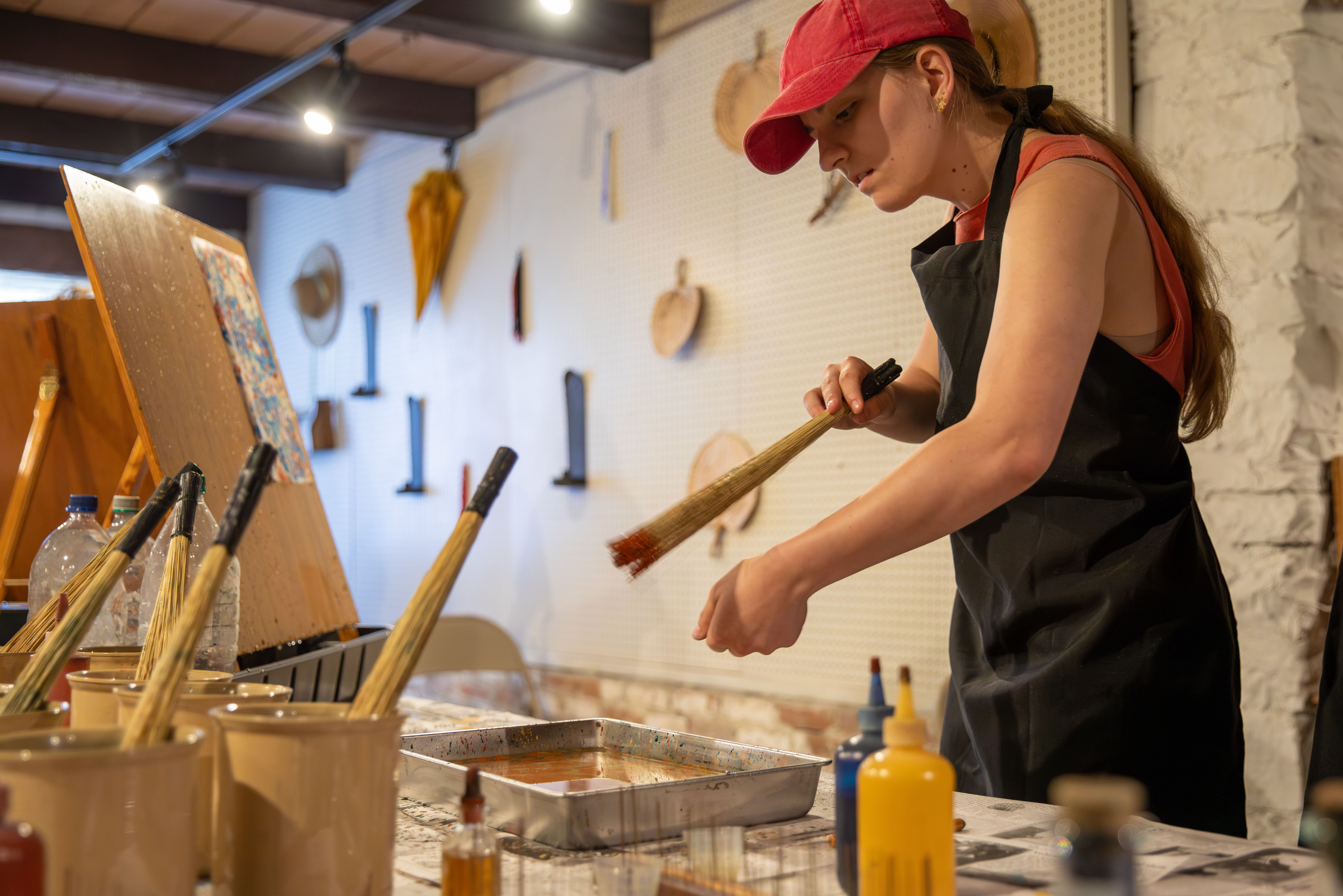 Historic Preservation majors paint something during a field trip.