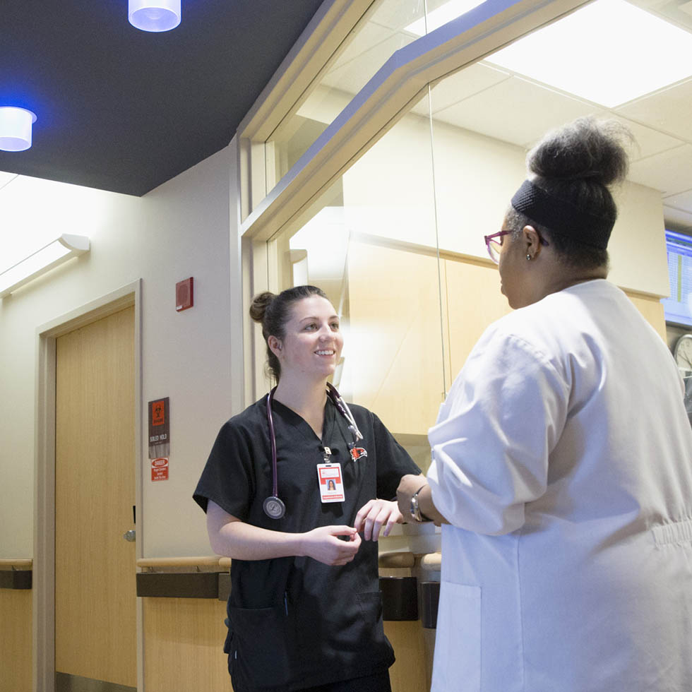 a medical student at Mercy Southeast talks to hospital staff