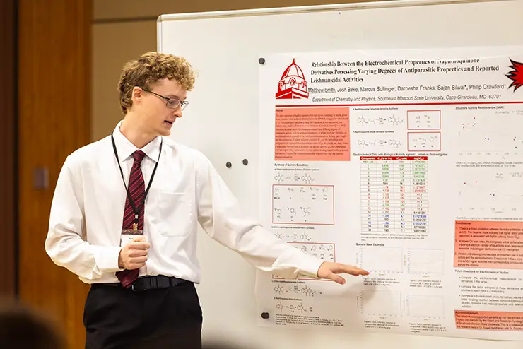 a SEMO chemistry student presents a poster about his research project for the student research conference