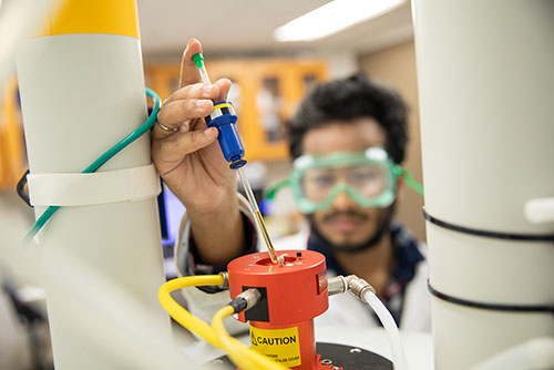 Southeast Missouri State University chemistry student performs an experiment in the lab.
