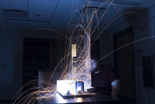 Southeast Missouri State University physic student performs an experiment. 