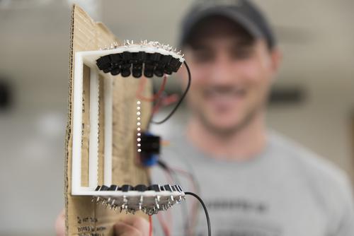 A Southeast Missouri State University physics student presents their gravity defying experiment. 