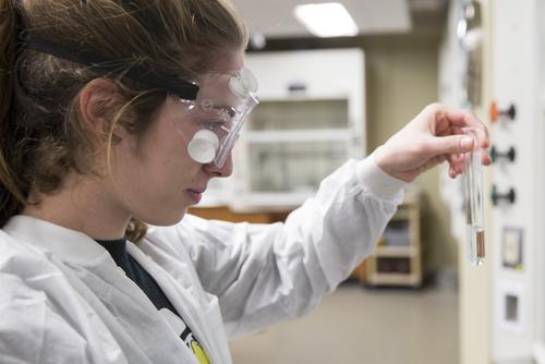 Southeast Missouri State University chemistry student inspects a test tube during her lab. 