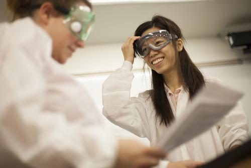 A Southeast Missouri State University chemistry student smiles while wearing goggles. 