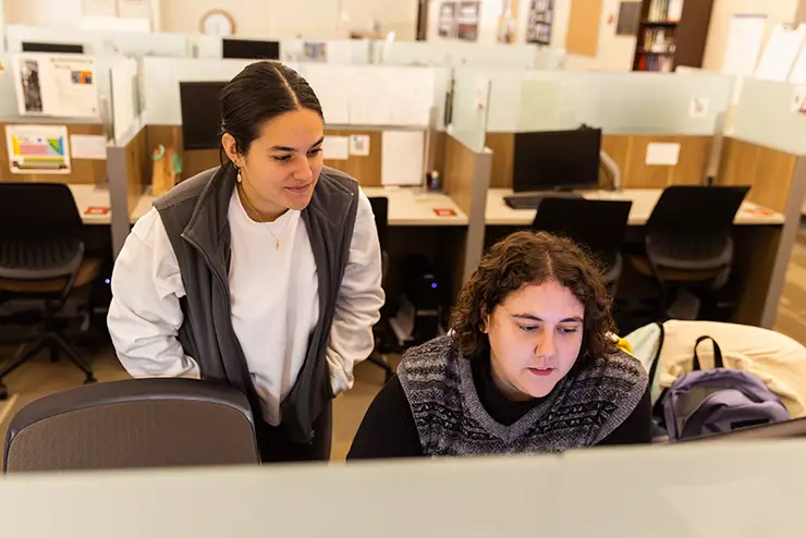 a tutor helps a student with a lesson