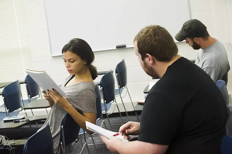 a group of math students work together on a problem