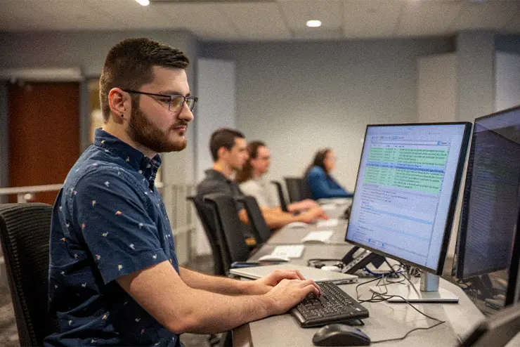 A community learner at SEMO is learning about cybersecurity, IT, and Computer science skills in the cyber range at Southeast Missouri State University