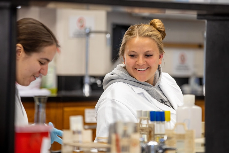 Two students at SEMO working in the chemistry lab during the mad science lab at Horizons