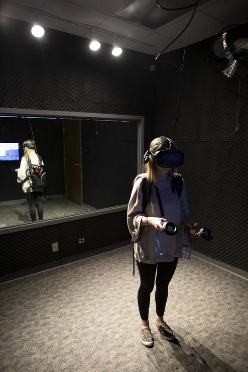 A student experiences a new perspective inside the Virtual Reality Room.