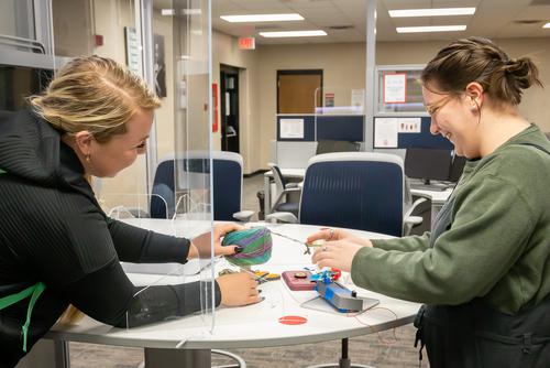 Students work together on a project at The EDvolution Center.
