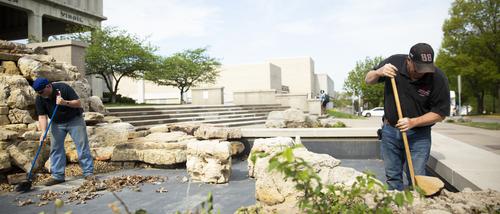 Facilities Management workers at Kent Library fountain