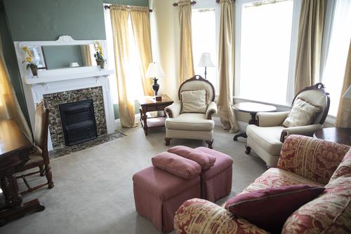 The inner living space of the Johnson Center features a couch and chairs.