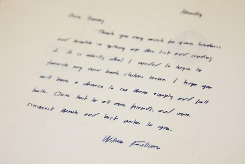 William Faulkner's name is seen at the bottom of a hand-written letter.