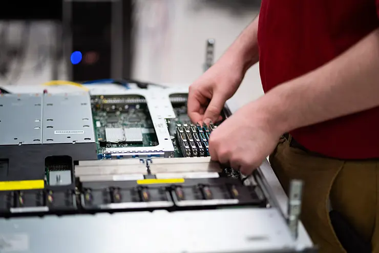 a SEMO computer science student works on a network in one of the computer labs