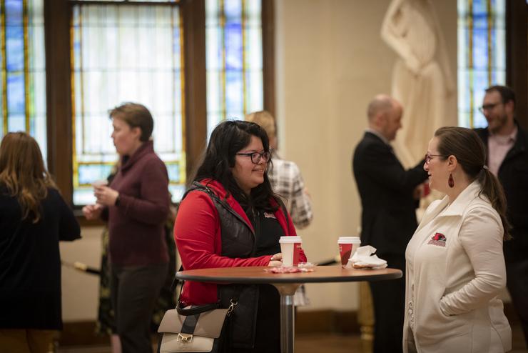 Two Southeast staff members interact during Faculty and Staff donuts for I Love SEMO Week. 
