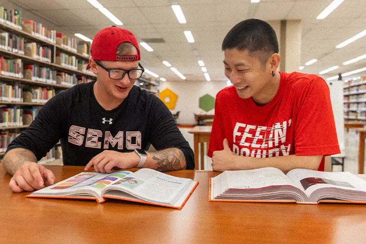SEMO Graduate students working together in the library at Kent Library SEMO. 