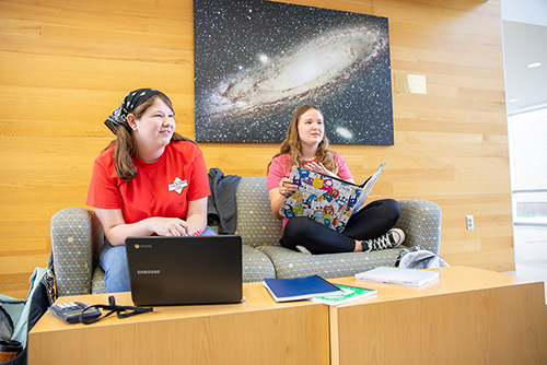 Students study together in the lobby of Dempster hall. 
