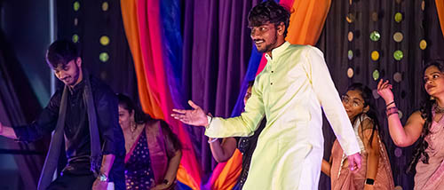 SEMO international students dance on stage during the carpe diem celebration