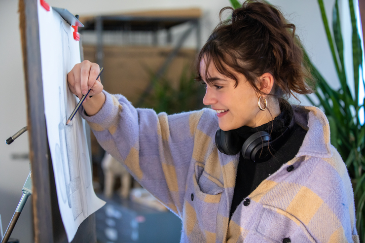 art student drawing during her arts and media program exercise