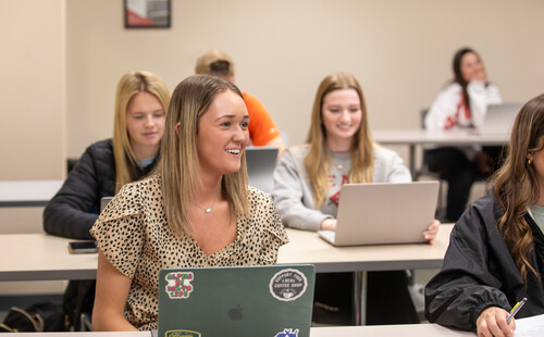 business student in class preparing for the future of business and marketing