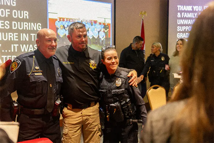 3 people celebrating Criminal Justice LEA graduation at SEMO