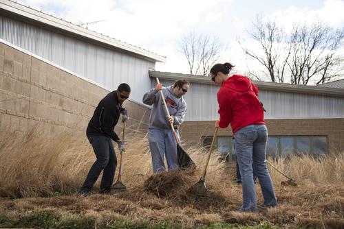 SEMO volunteers at Cape Girardeau Conservation Nature Center participate in a community service project, cleaning and maintaining grassy outdoor areas.