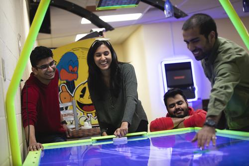 Southeast Missouri State University students playing air hockey and enjoying recreational activities on campus.