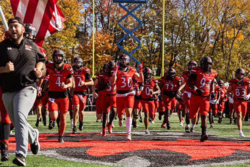 The SEMO football team running out onto the field after the Lock 'n Rock.