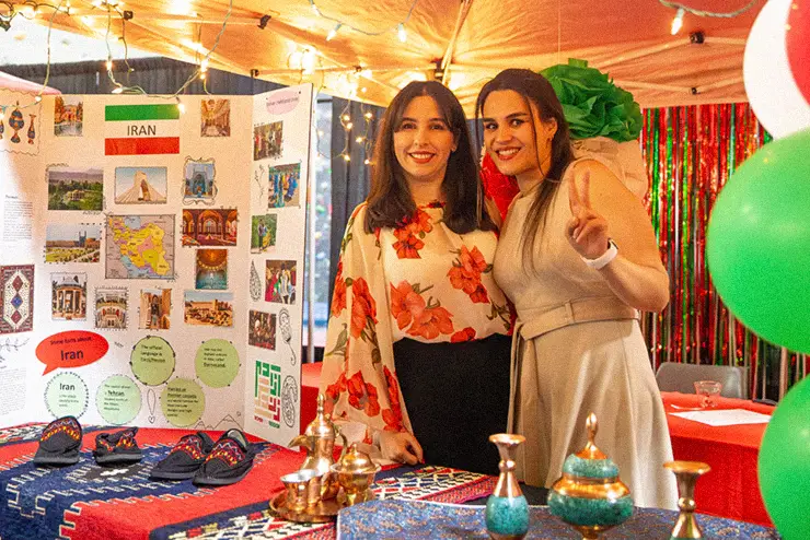 a SEMO student wearing hijab smiles and talks during an event