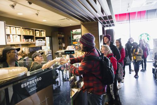 Students wait in line to be served at Starbucks in the University Center. 