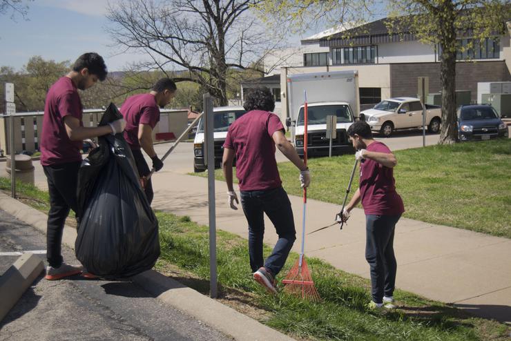  A diverse group of students clean up the lawn areas of Southeast’s campus.