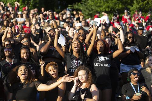 Fans cheer at a Redhawk football game at Houck Field.