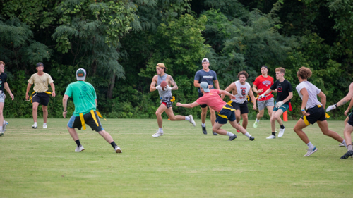 Students play a game of intramural flag football. 