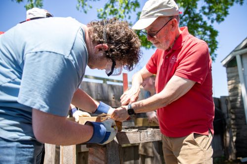 A sEMO student and faculty work during the historic preservation field trip.