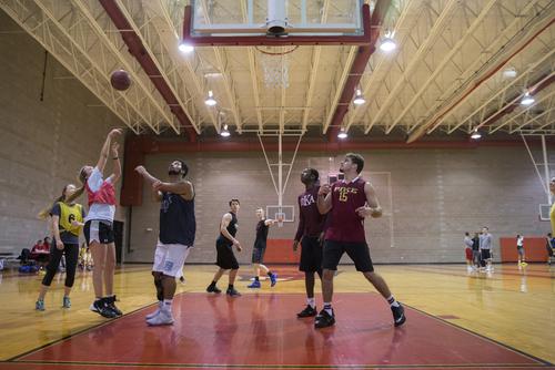A SEMO student takes a shot during intramural basketball in the Student Rec. Center. 