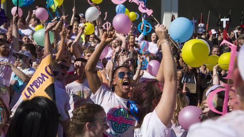 Student cheers from the crowd during Chariot Race event. 