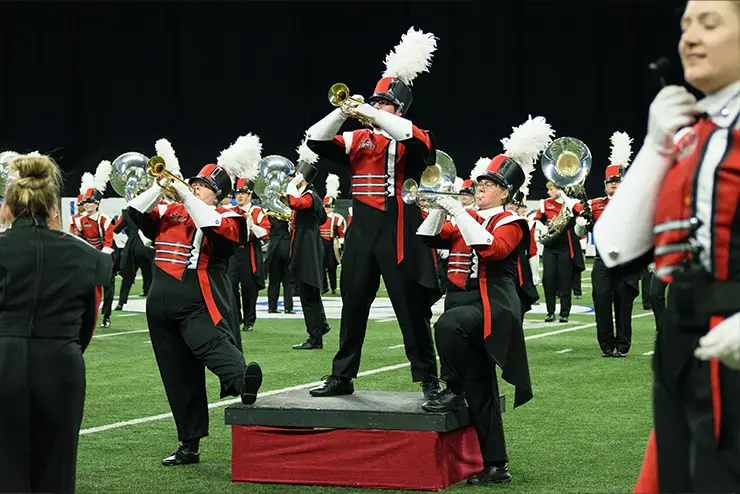 SEMO Marching Band performing at a sports event featuring a trumpet member