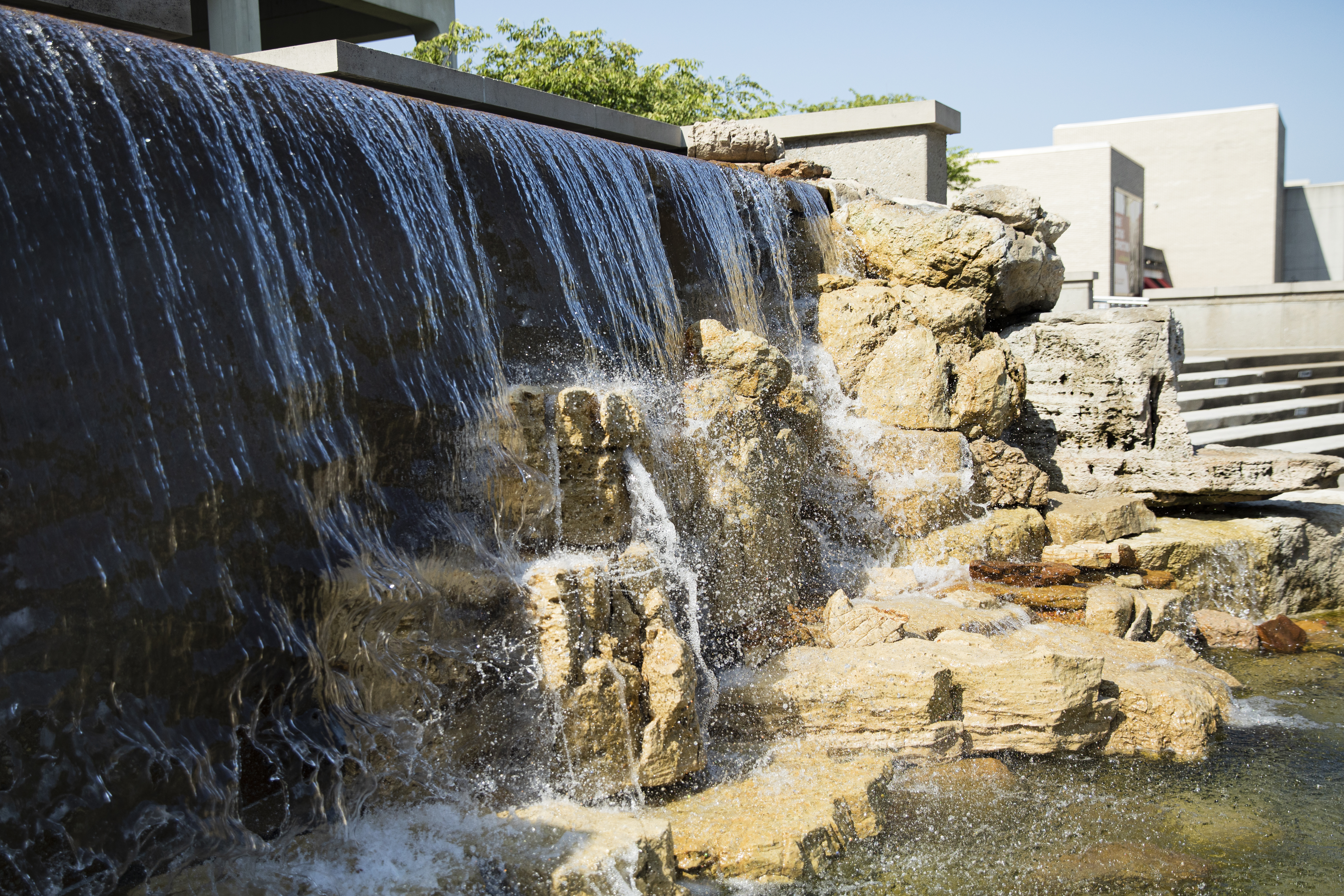 a close up view of the waterfall fountain in front of Kent Library