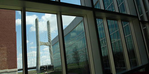 looking through the river campus cultural arts center windows at the Mississippi bridge