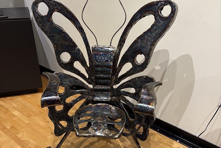 An iron butterfly sculpture.