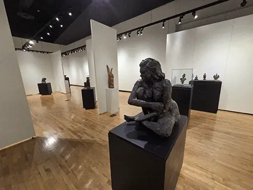 a view of the setup of a sculpture exhibition in Crisp Museum