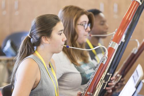 Students attending the Music Academy play bassoons.