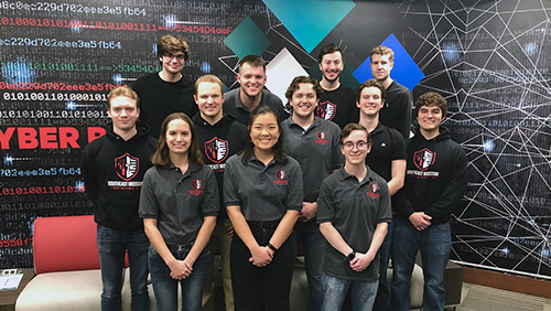 Group portrait of the 12 student members of Southeast's Cyber Defense Team.