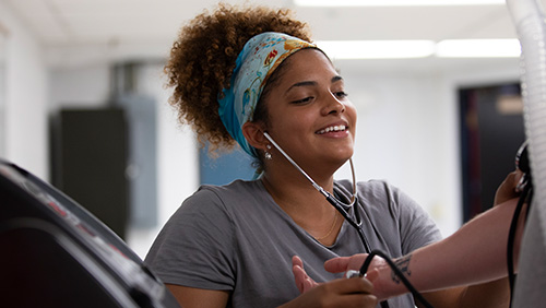 nutritioncounseling-nf-medium500x282.jpgImage of student administering blood pressure test.