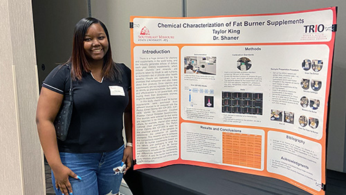 Image of Taylor King with her research project poster.