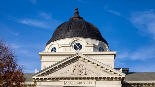 The Academic Hall dome in front of a bright blue sky.