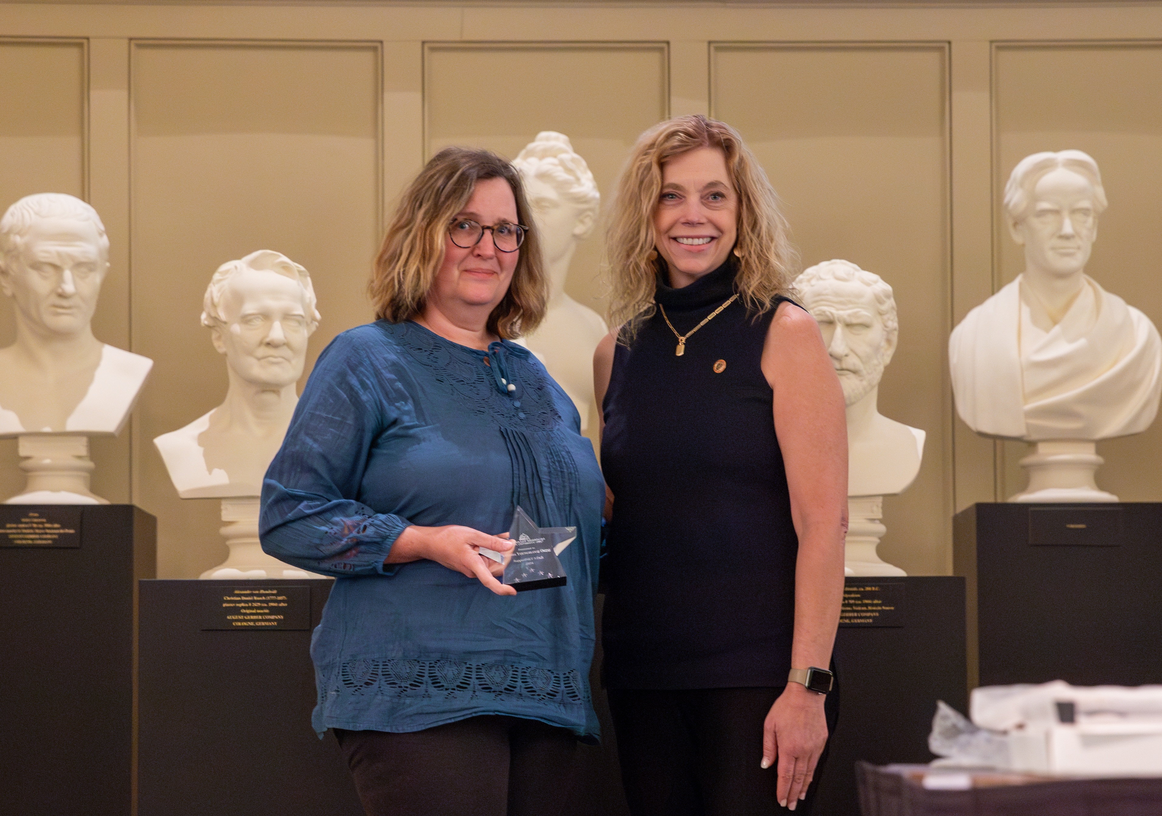 Alisha Youngblood Ortiz receives her student success award.